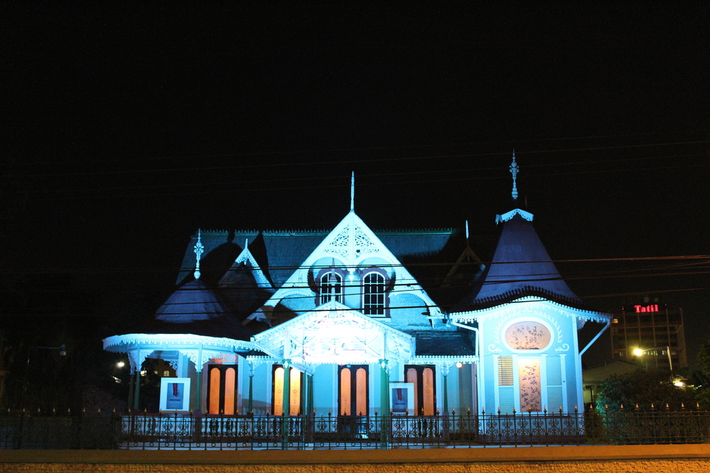The Gingerbread House, a Victorian-style mansion at Queen's Park Savannah in Port of Spain, lit at night