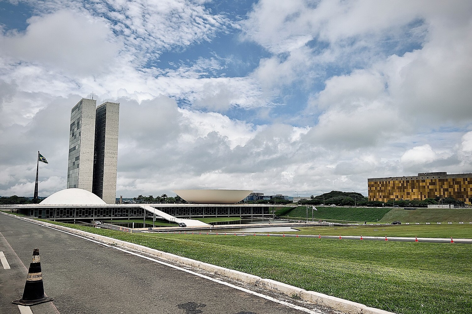 The National Congress building on the Esplanada in Brasilia under a cloudy sky