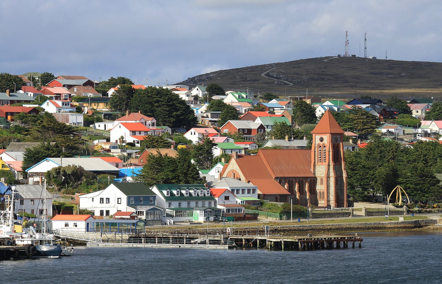 The waterfront at Stanley in the Falkland Islands with houses and a church