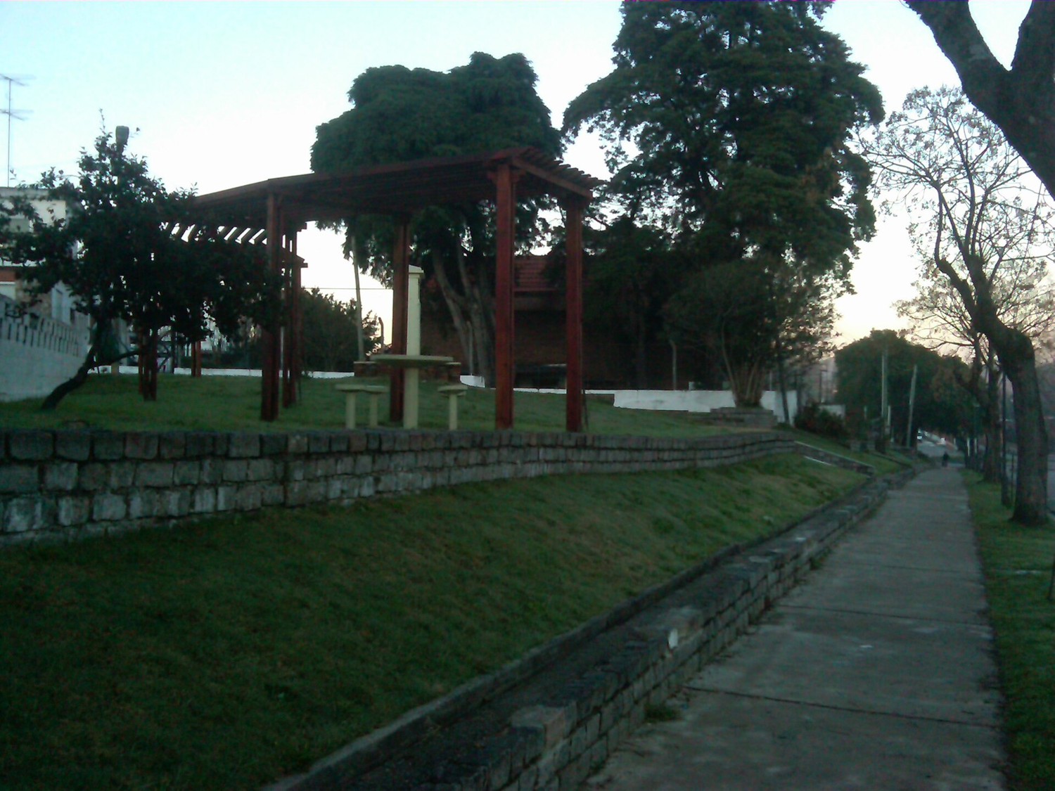 A tree-lined path in a park in Minas, Lavalleja, Uruguay