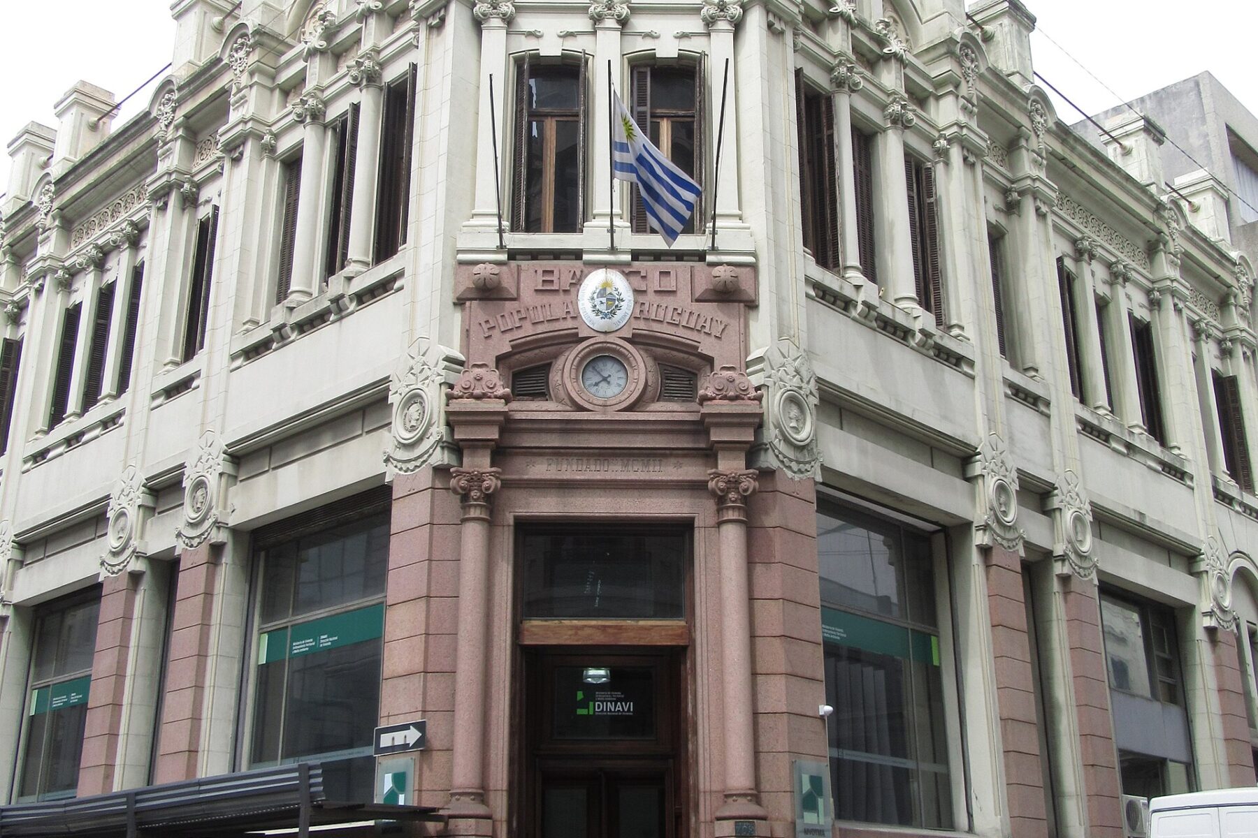 Building with Uruguayan flag and 'Banco Popular Uruguay' sign