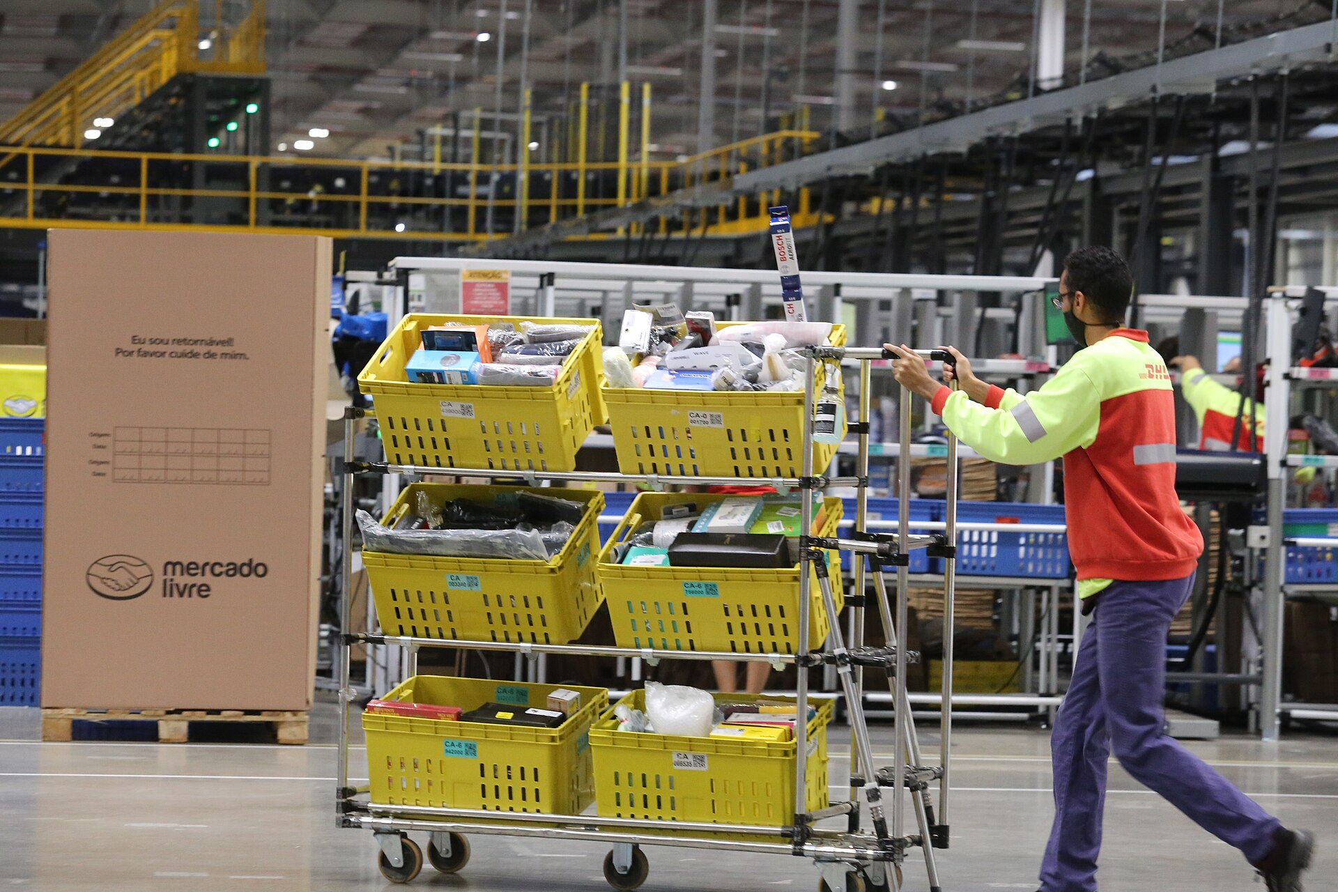 What is Mercado Libre — a worker moves orders through a Mercado Livre fulfilment centre in Brazil
