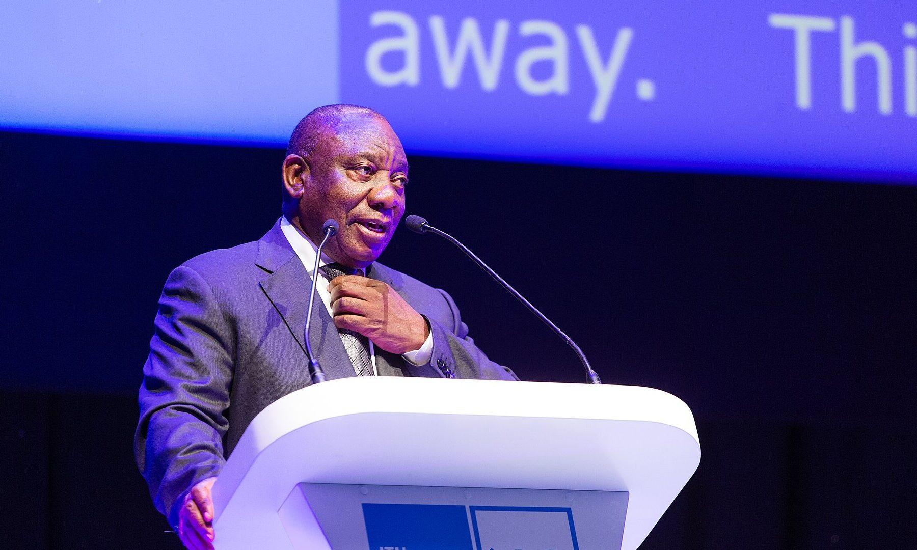 Cyril Ramaphosa, president of South Africa, speaking at a podium at ITU Telecom World in Durban