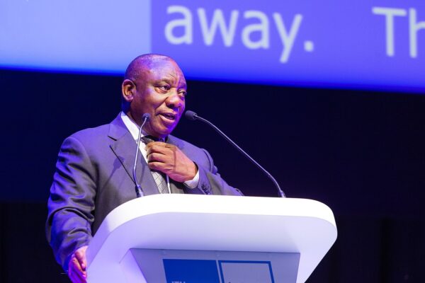 Cyril Ramaphosa, president of South Africa, speaking at a podium at ITU Telecom World in Durban