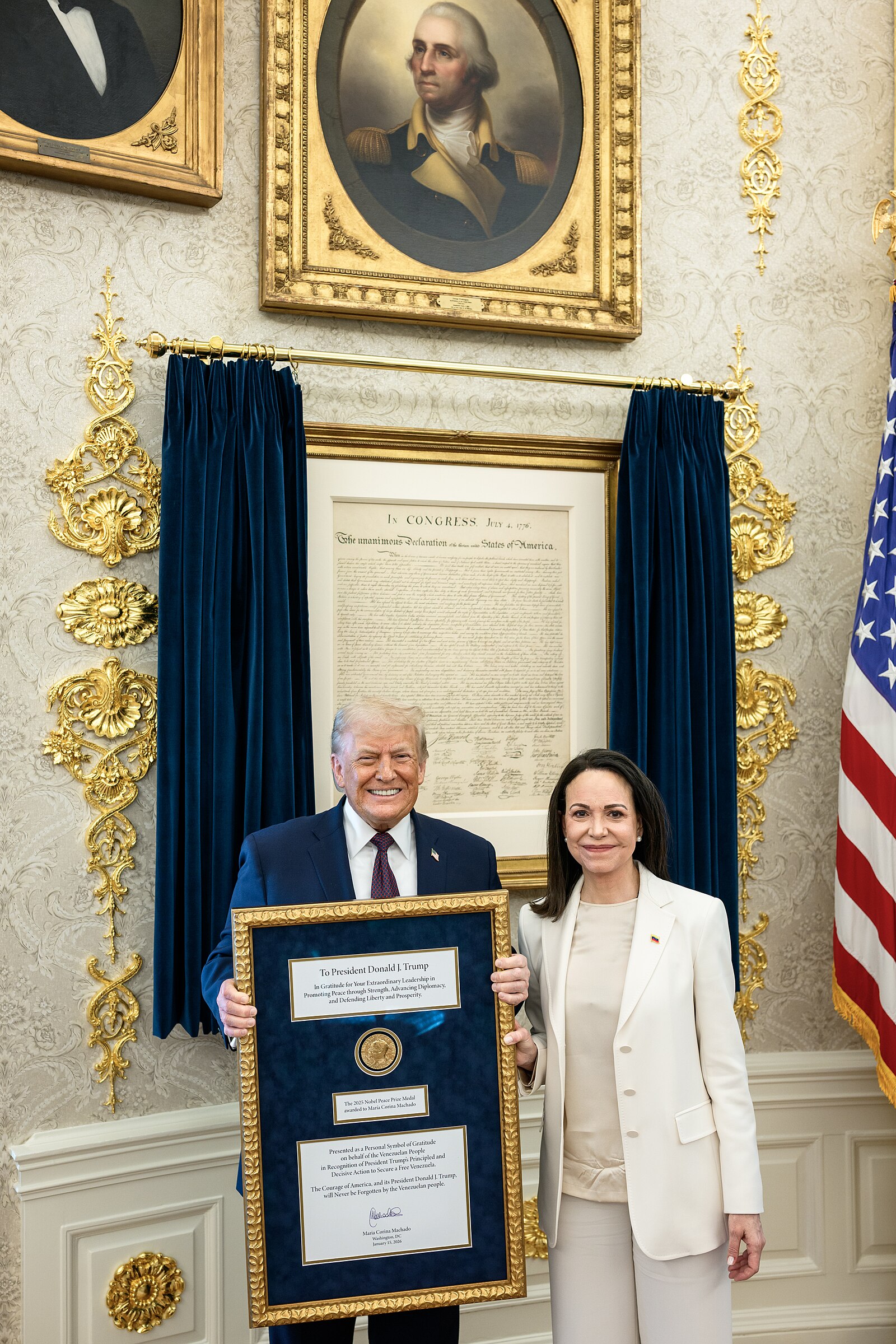 María Corina Machado with Donald Trump, who holds the framed Nobel medal, in the Oval Office on 15 January 2026