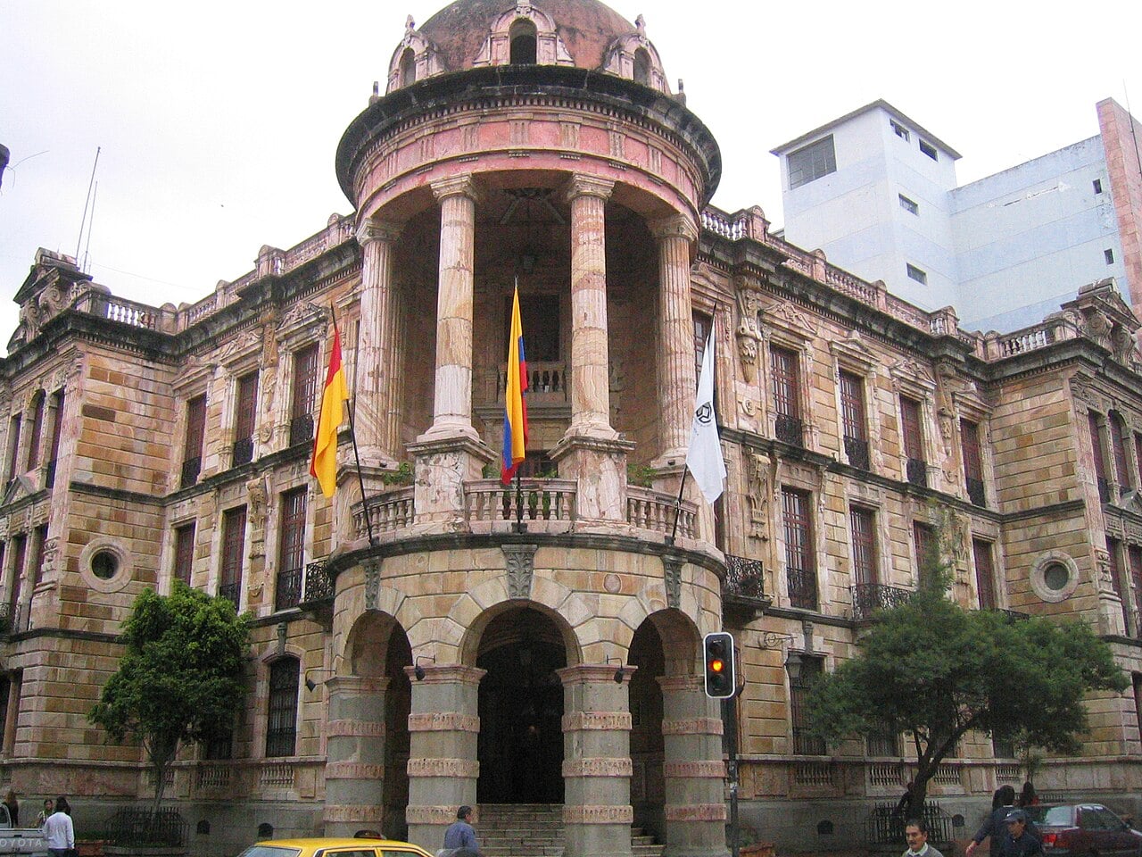 World Bank Ecuador program: the domed municipal building of Cuenca, Ecuador, with city and national flags