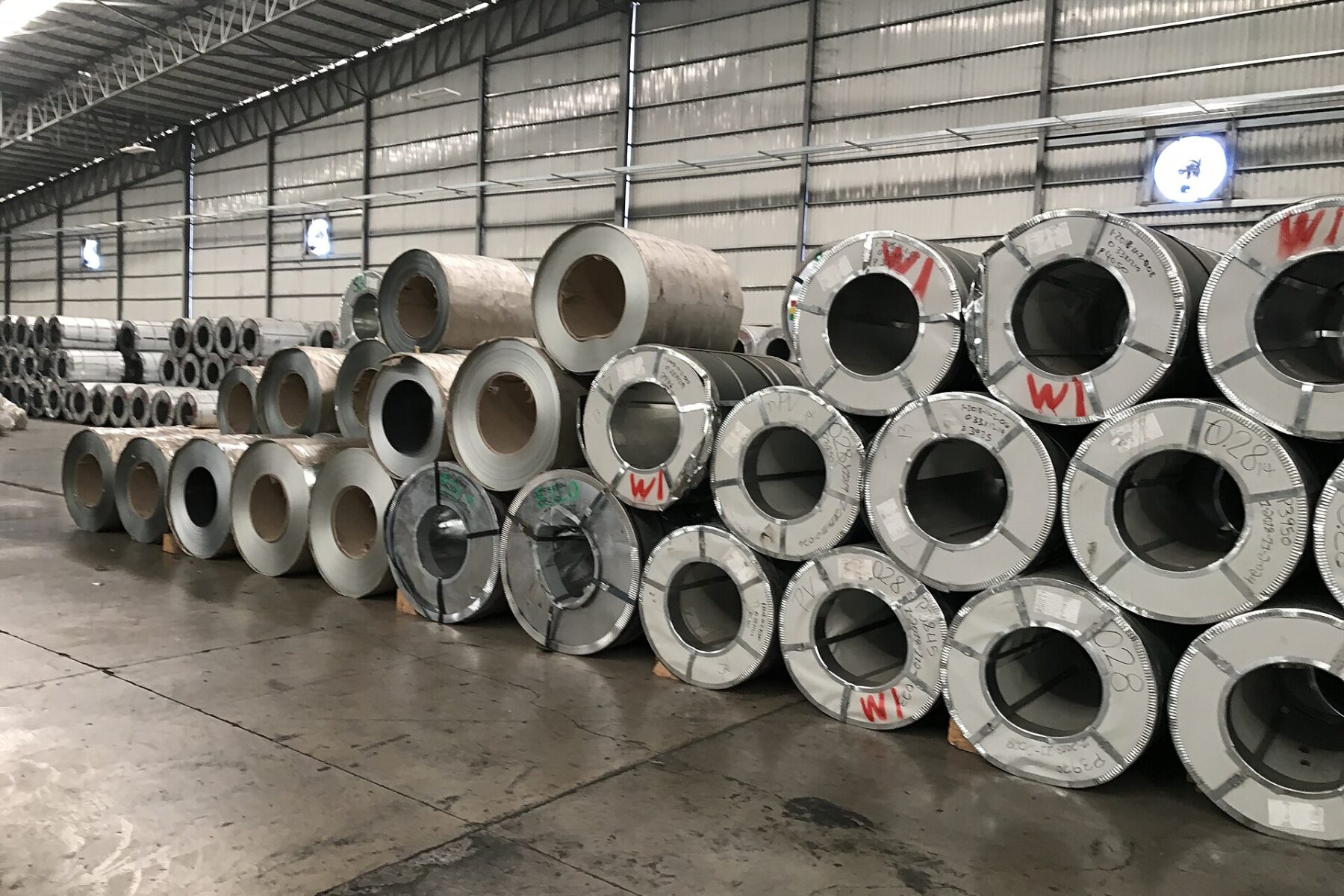 Galvanised steel coils stored in a warehouse, the main end use for zinc