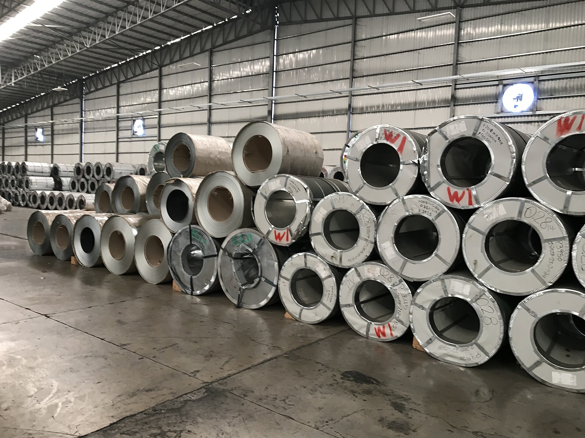 Galvanised steel coils stored in a warehouse, the main end use for zinc.