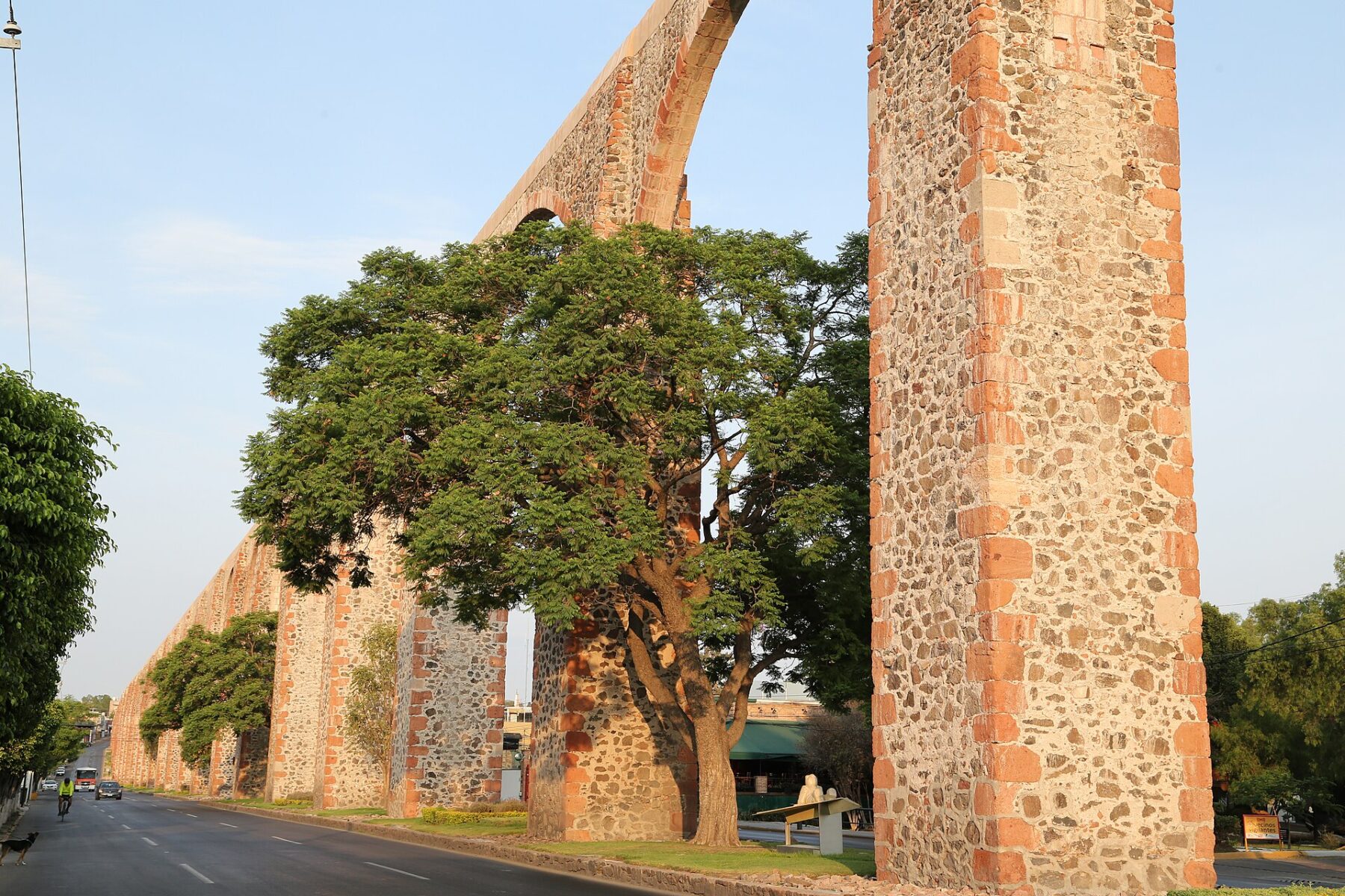 Arches of the Querétaro aqueduct in warm evening light, Mexico