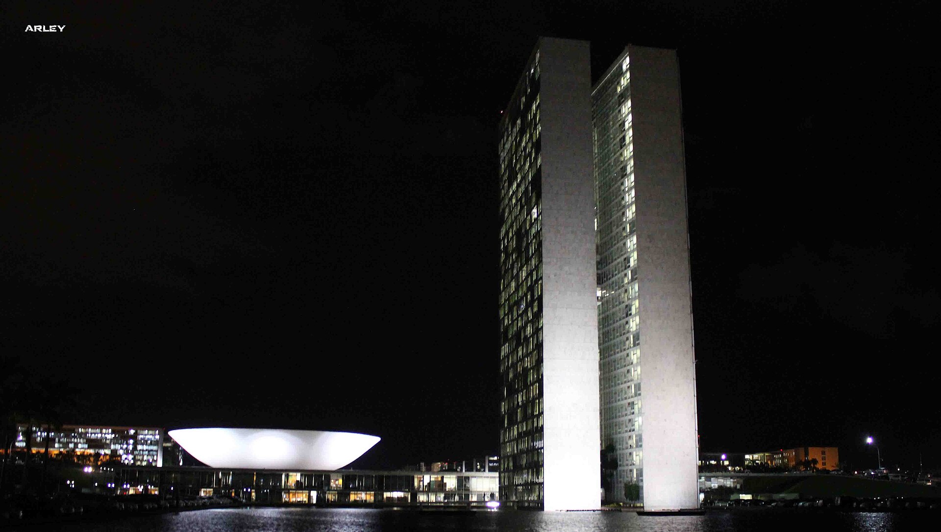 Brazil's National Congress towers and bowl-shaped Senate dome in Brasília lit at night