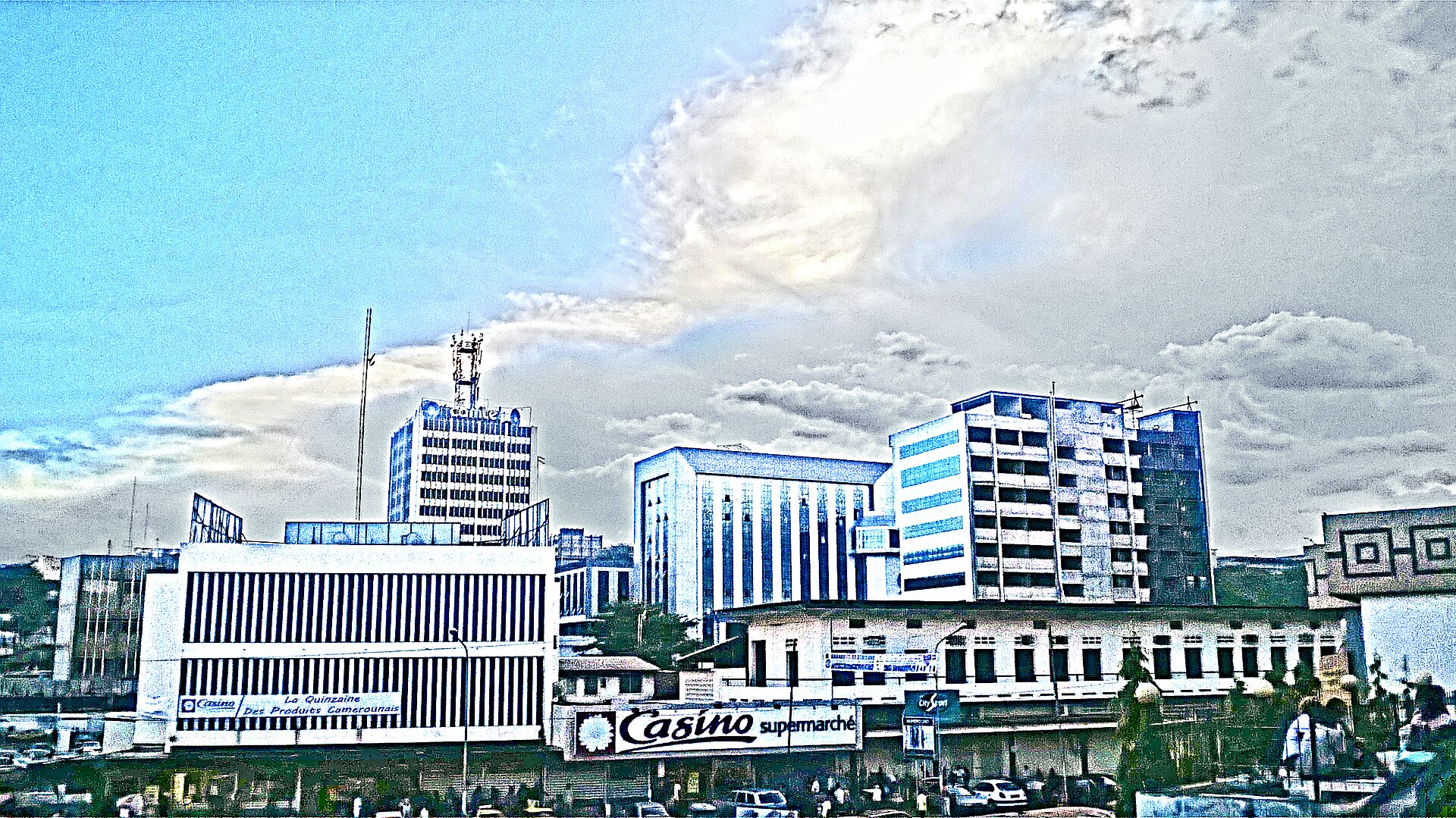 Downtown Yaoundé skyline with modern high-rise buildings and green hillsides