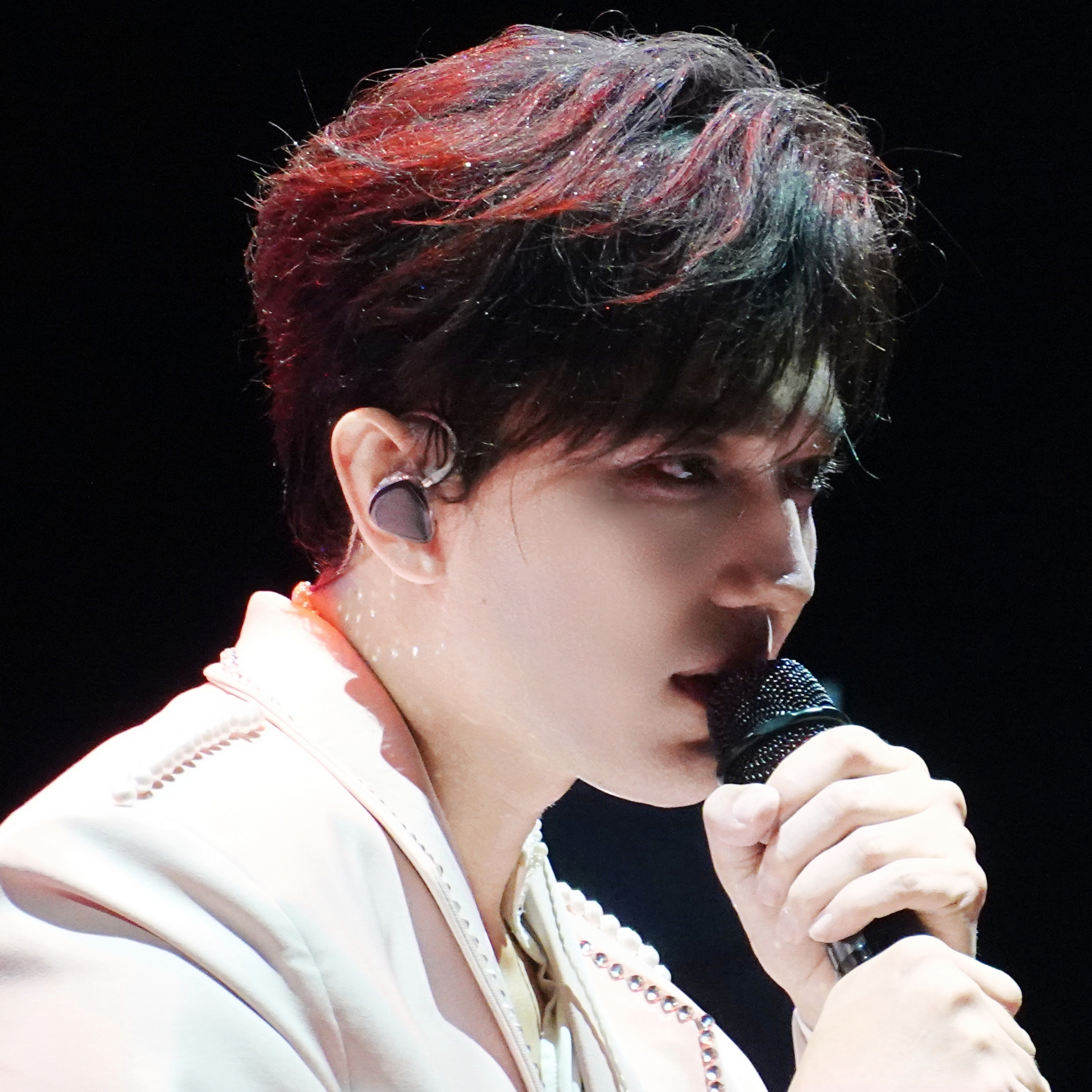Dimash Qudaibergen performing on stage with dramatic lighting at OVO Arena Wembley in London, 2025