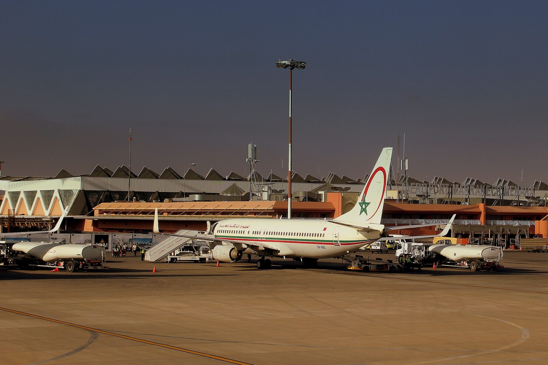 A Royal Air Maroc Boeing 737-800 parked on the apron in front of the terminal at Marrakech Menara Airport