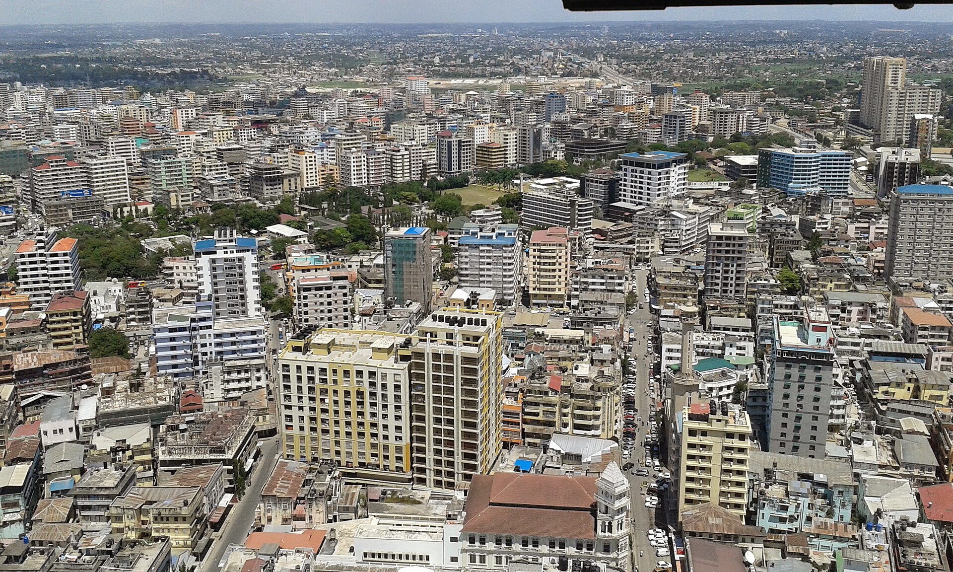 Aerial view over the dense business district of Dar es Salaam with mid-rise buildings