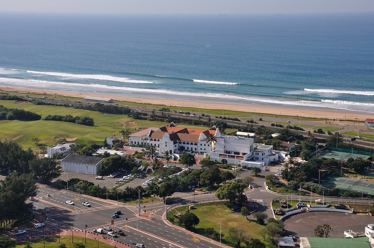 Aerial view of the Durban Country Club clubhouse and golf course beside the Indian Ocean in Durban, South Africa