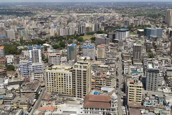 Aerial view over the dense business district of Dar es Salaam with mid-rise office and apartment buildings along busy streets