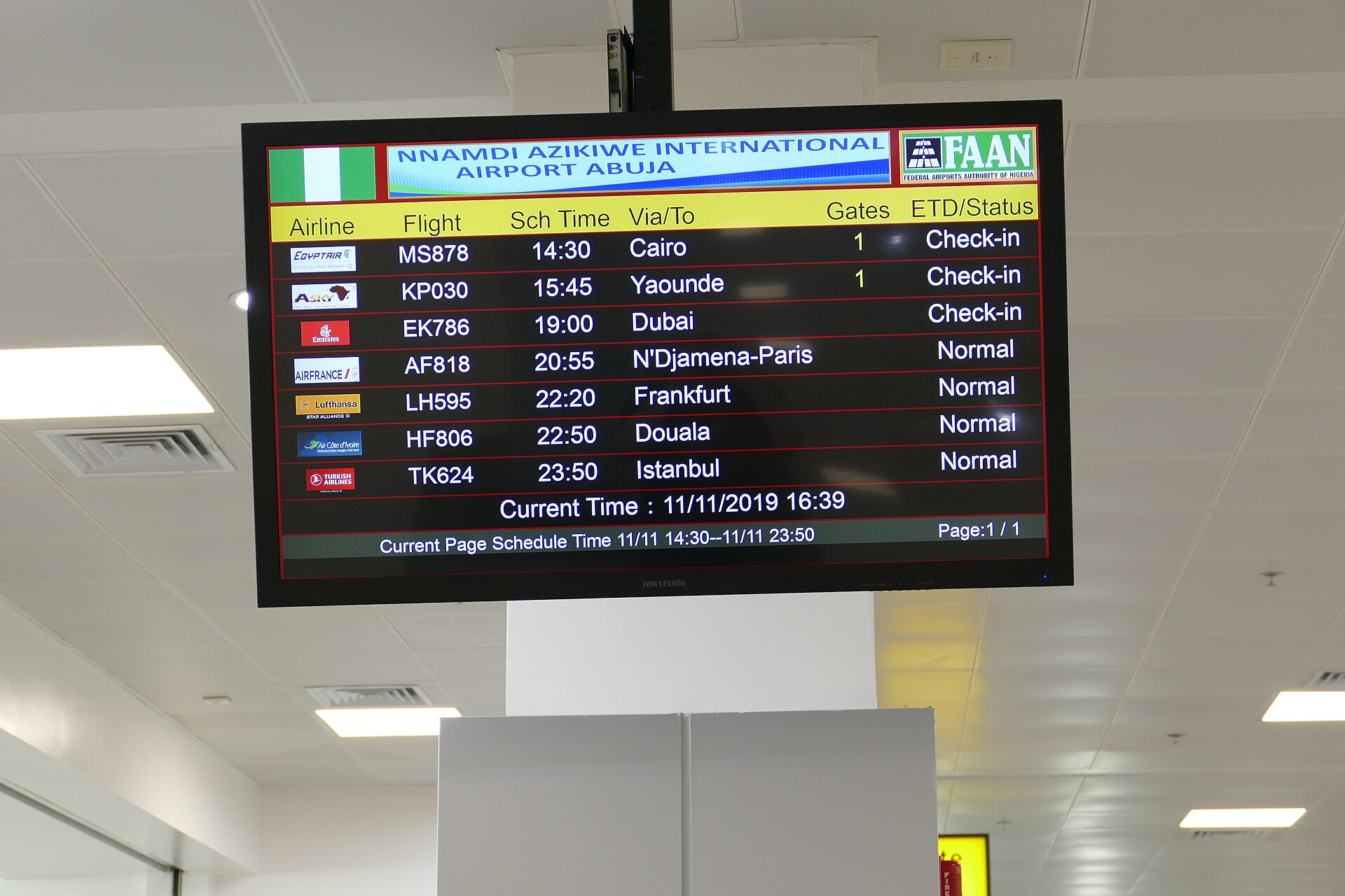 A departures board at Nnamdi Azikiwe International Airport Abuja listing flights to Cairo, Yaounde, Dubai, Paris, Frankfurt, Douala and Istanbul