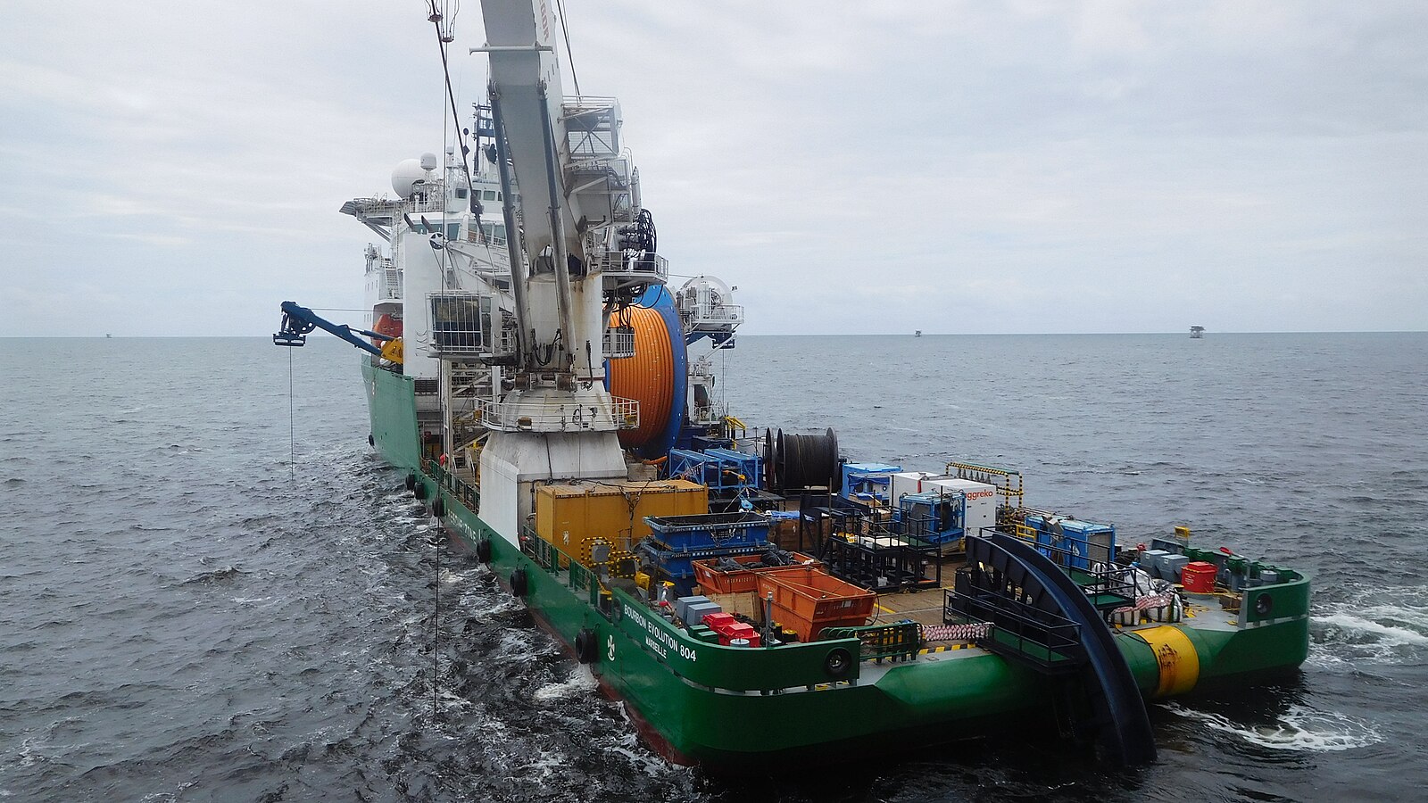 Angola geopolitics and oil: a pipe-laying vessel installs a flowline at an offshore field