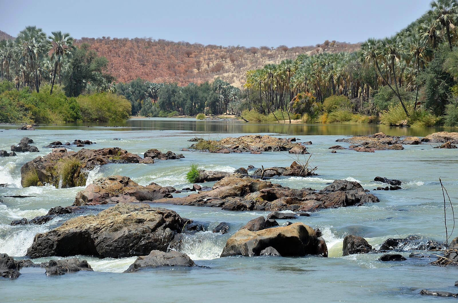 Angola neighbours: the Kunene River at Epupa Falls on the Angola-Namibia border