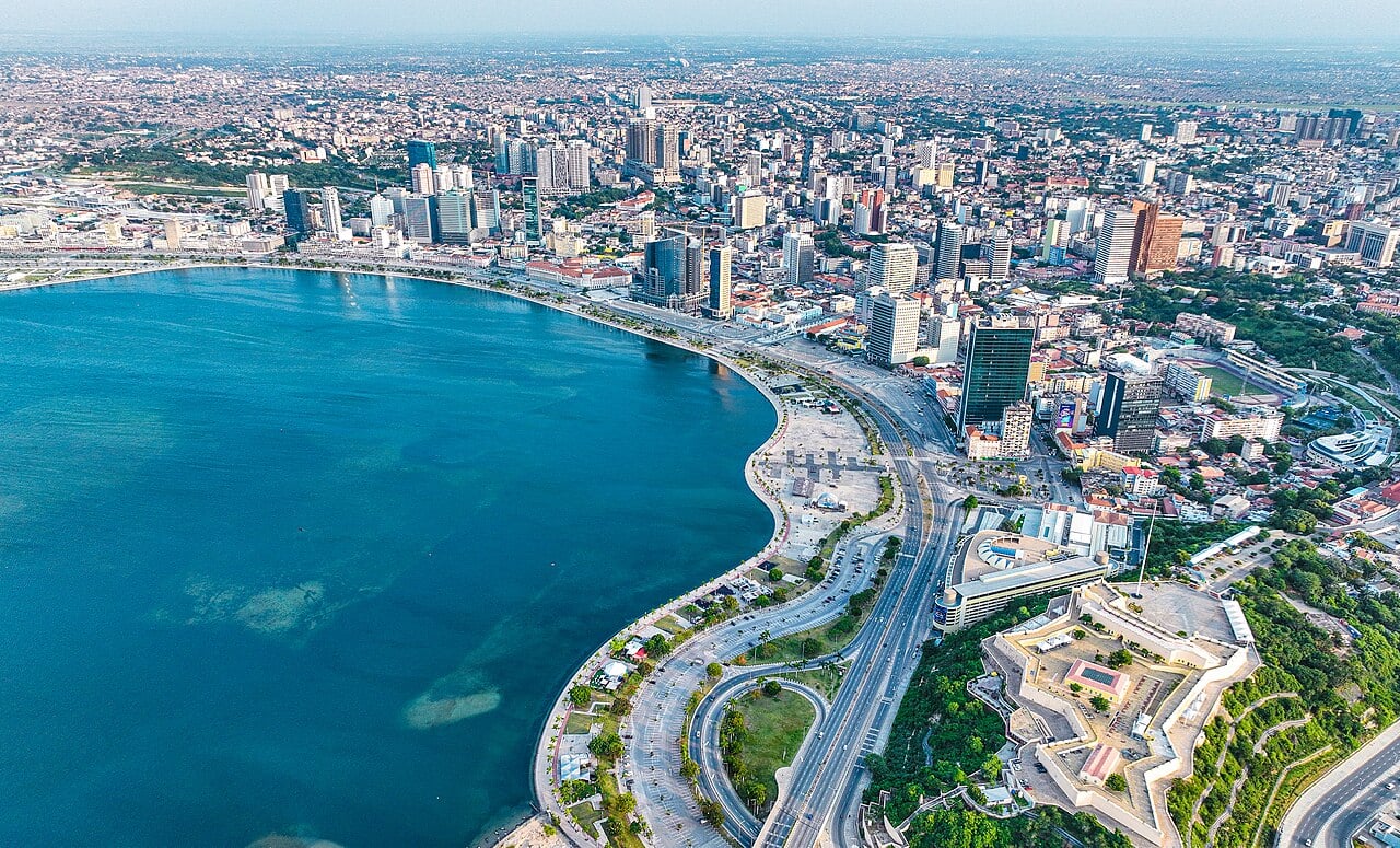 Aerial view of Luanda Bay, the Marginal seafront and the city centre, with the old Fortaleza de São Miguel fort at right