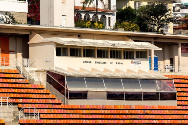 Press and radio booth above the orange seats of the Pacaembu stadium in São Paulo.