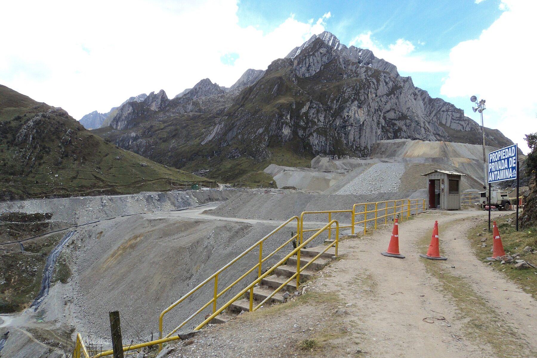 Mine access road and waste dump below mountains at the Antamina mine in Áncash, Peru