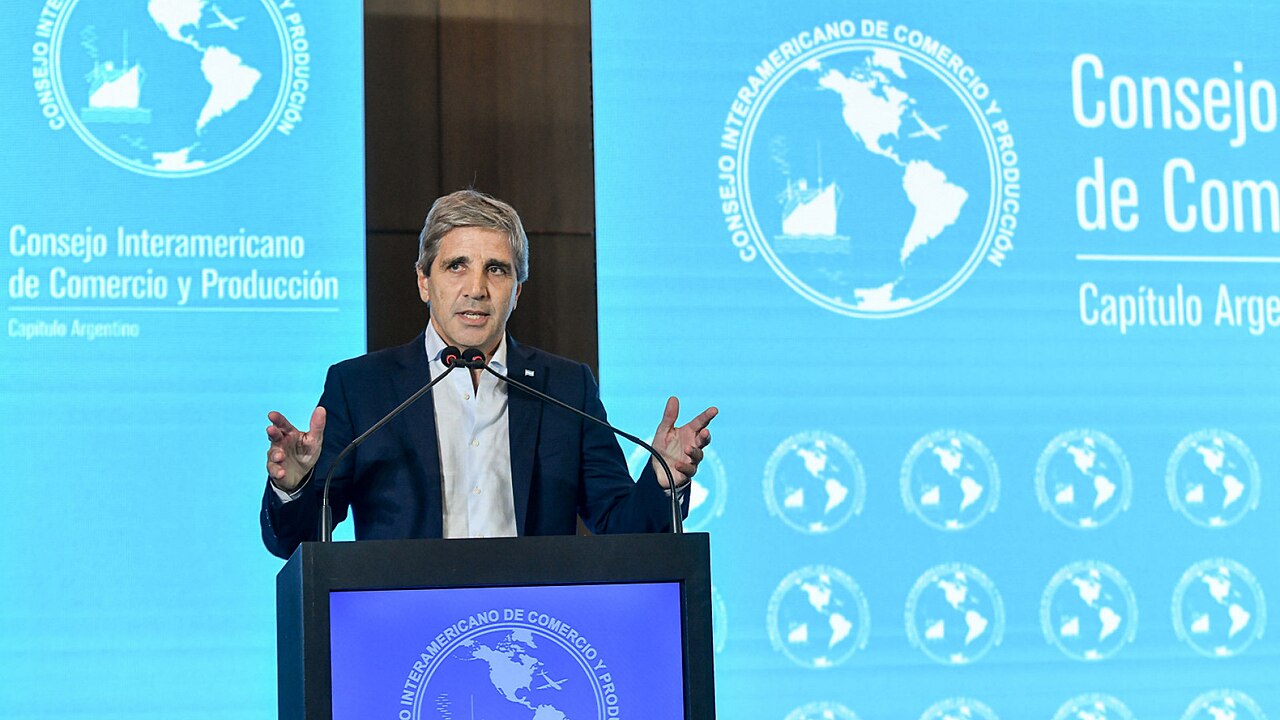 Argentina Economy Minister Luis Caputo speaking at a podium