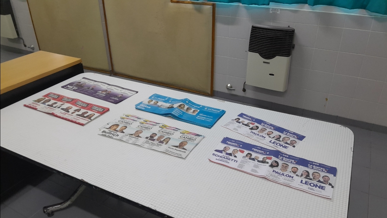 A polling table with ballot papers for the candidates in the 2023 Argentine presidential election