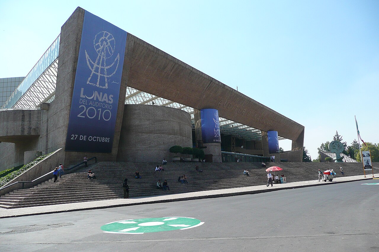 Visitors sit on the wide steps in front of the Auditorio Nacional concert hall in Mexico City.