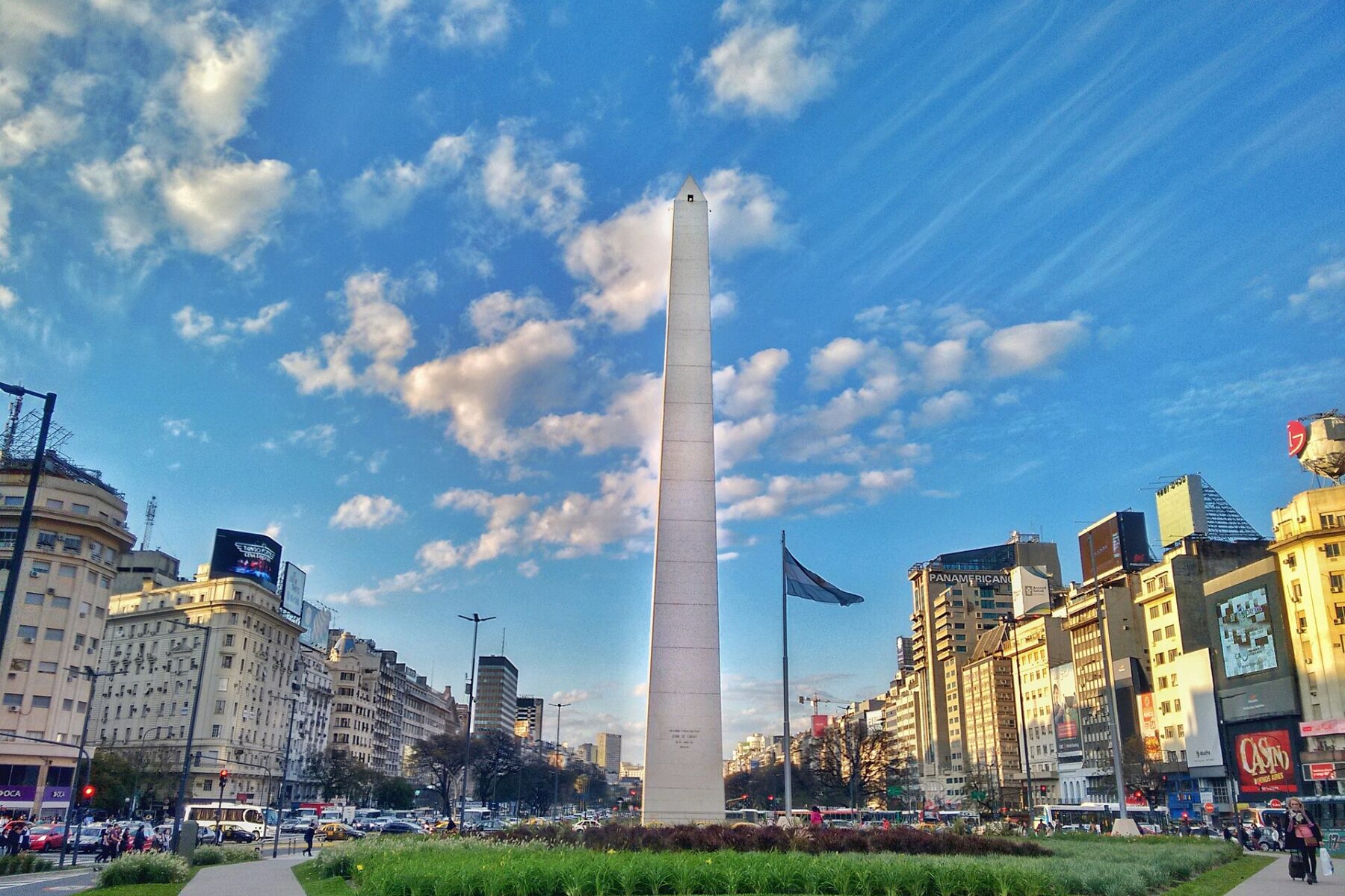 The Obelisk on Avenida 9 de Julio in Buenos Aires under a blue sky with clouds