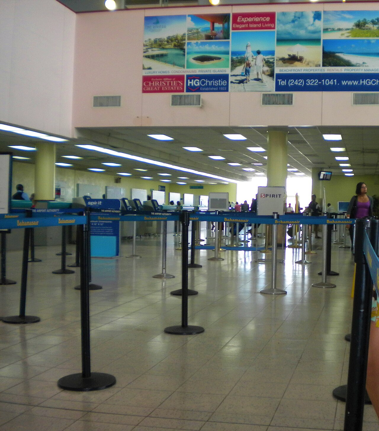 Empty check-in lanes with airline signs at the Lynden Pindling International Airport in Nassau