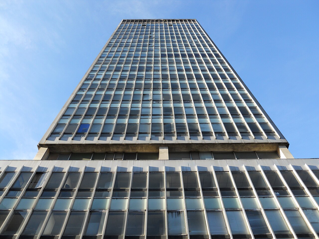 Glass facade of the former Banco de Bogotá office tower seen from street level in central Bogotá, Colombia