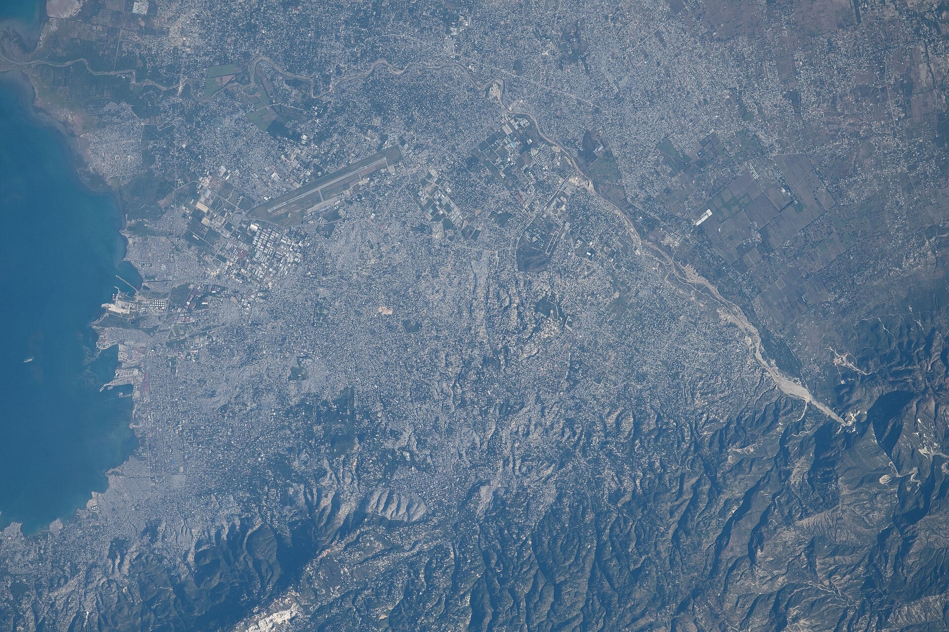 The Port-au-Prince area seen from orbit, with the airport, port, bay and mountains