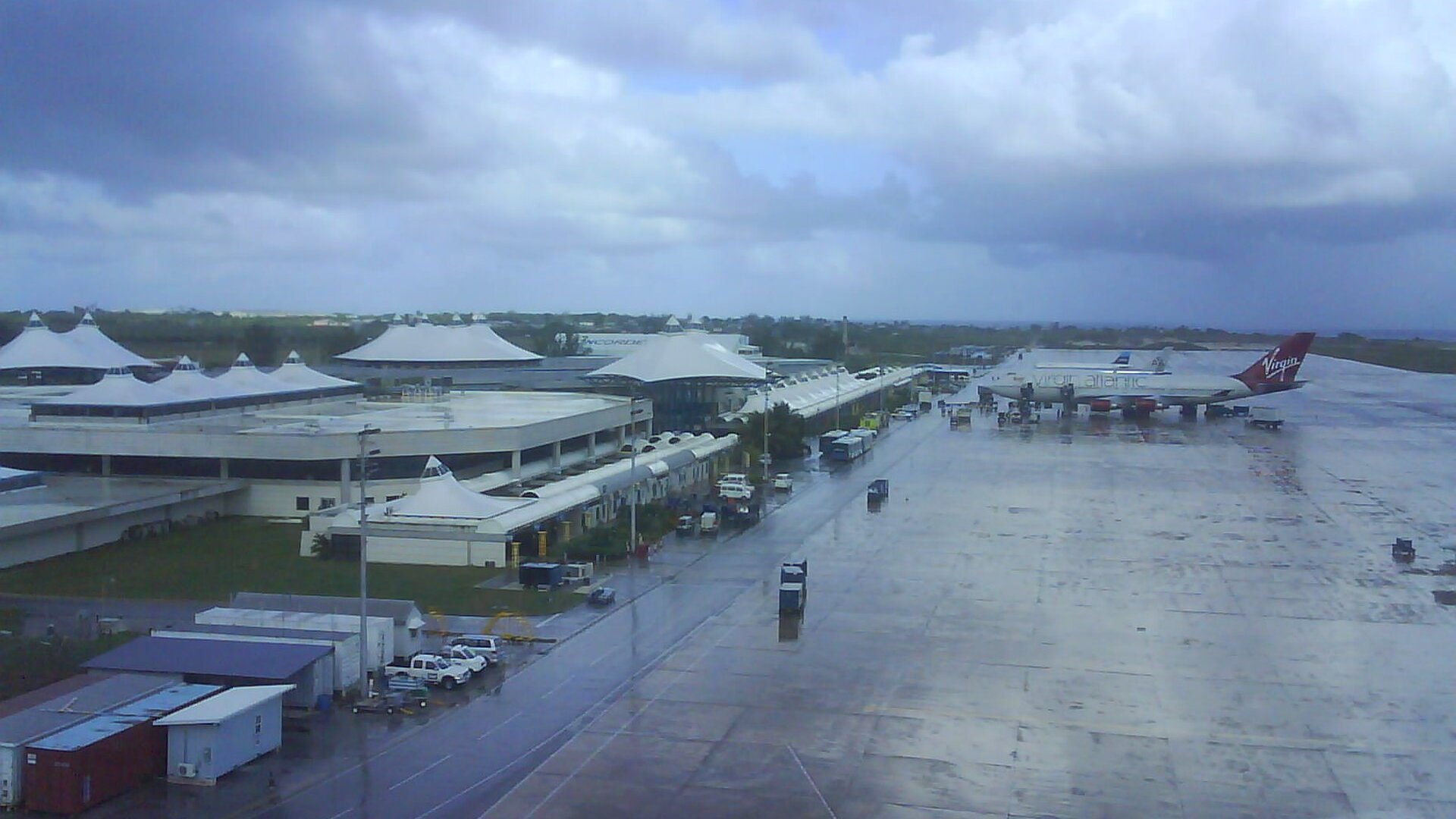Aircraft including a Virgin Atlantic jet parked beside the departures terminal at Grantley Adams International Airport in Barbados