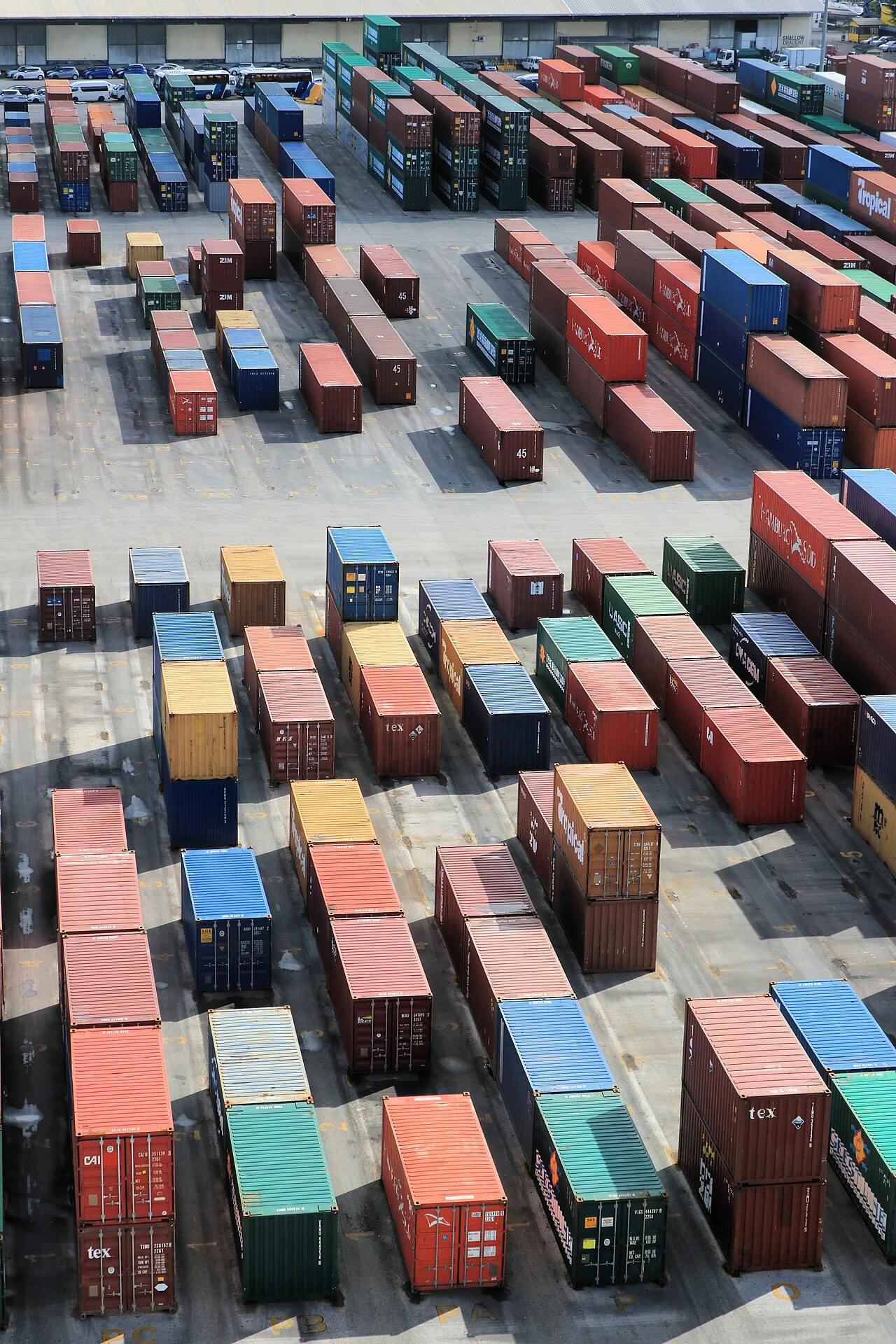 Rows of shipping containers in the container park of the Port of Bridgetown, seen from above.