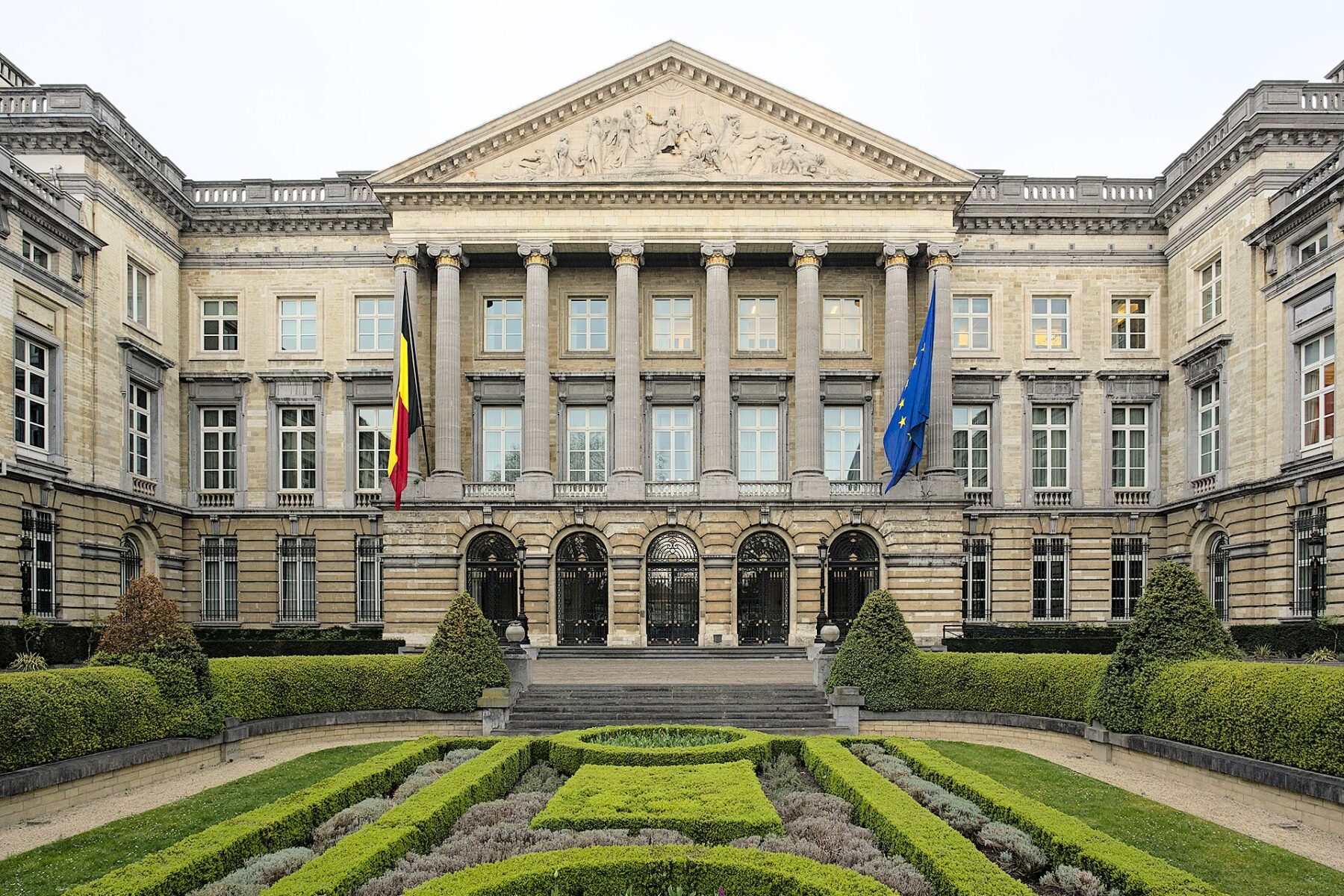 The Palais de la Nation in Brussels, home of the Belgian Federal Parliament, with Belgian and EU flags