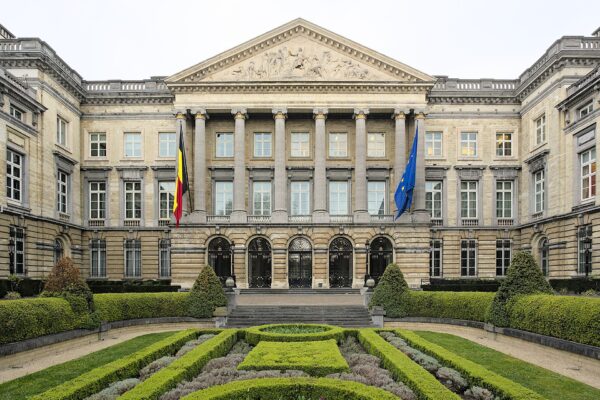 The Palais de la Nation in Brussels, home of the Belgian Federal Parliament, with Belgian and EU flags