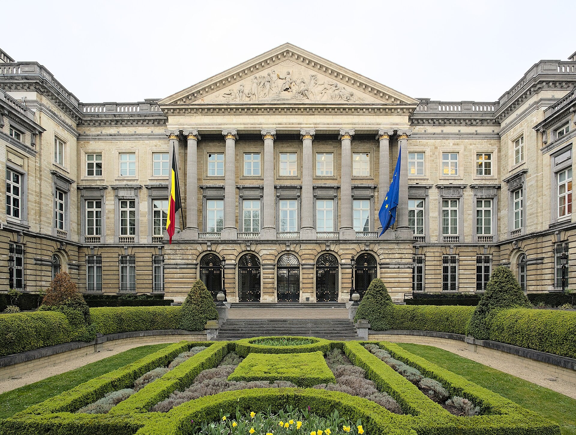 The Palais de la Nation in Brussels, home of the Belgian Federal Parliament, with Belgian and EU flags