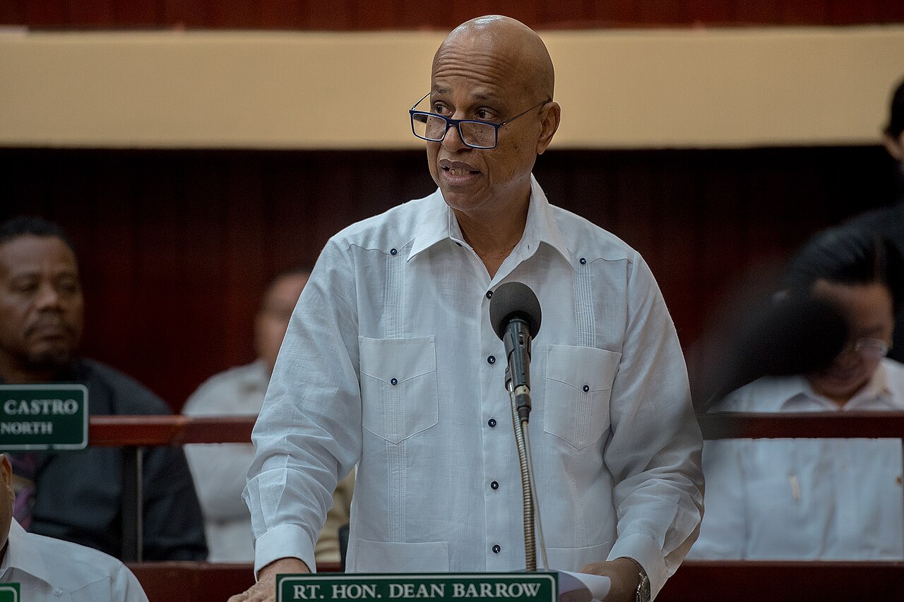 Dean Barrow, then prime minister of Belize, speaks at a microphone in the National Assembly during a visit by Taiwan's president.