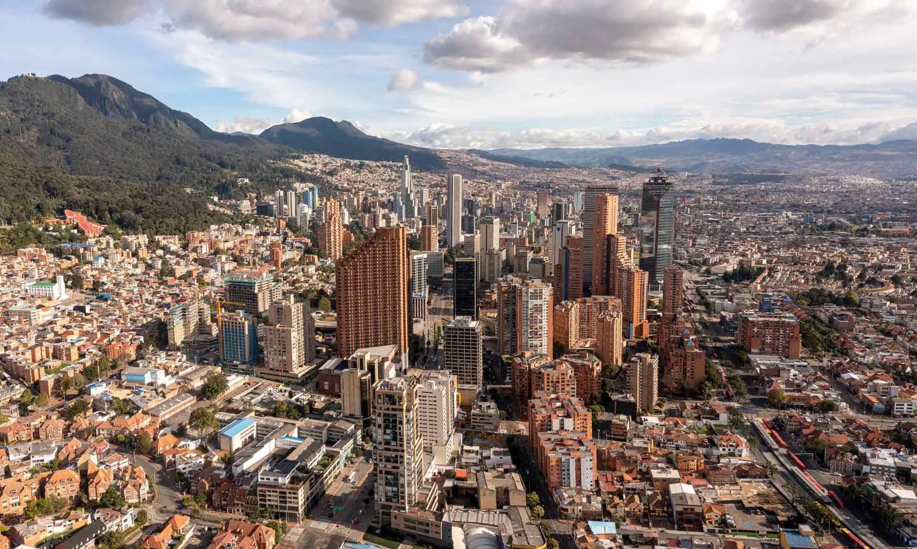 Aerial view of the skyline of Bogotá, Colombia's capital, with the Andes behind