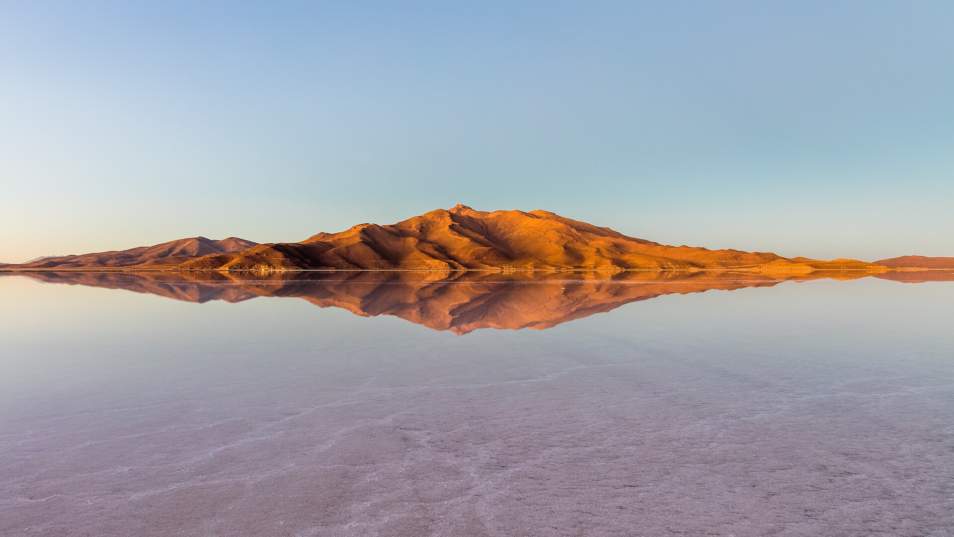 Bolivia geopolitics: the Salar de Uyuni salt flat at sunrise, home of the country's lithium