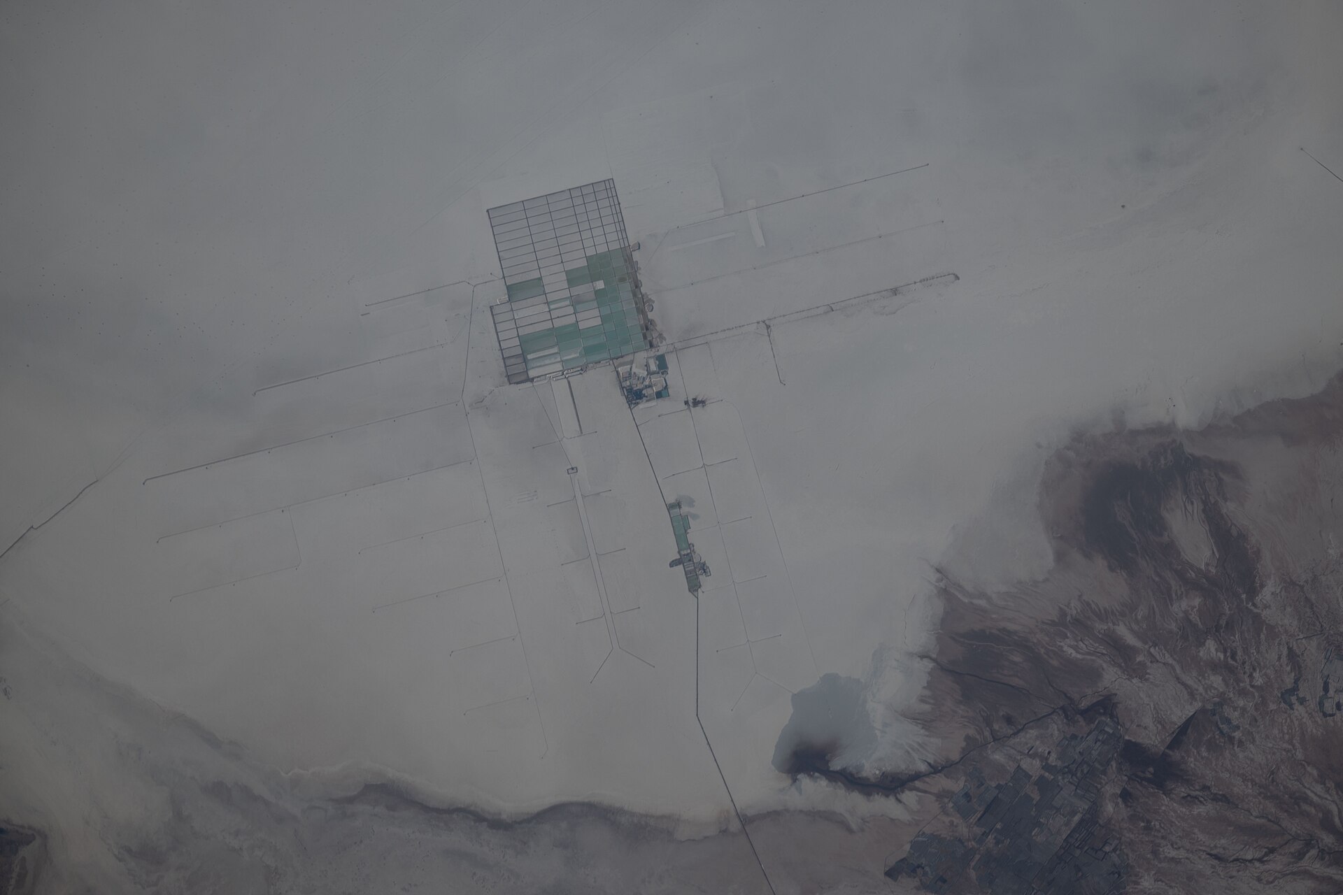 Bolivia geopolitics and lithium: evaporation ponds of an extraction facility on the Salar de Uyuni seen from orbit