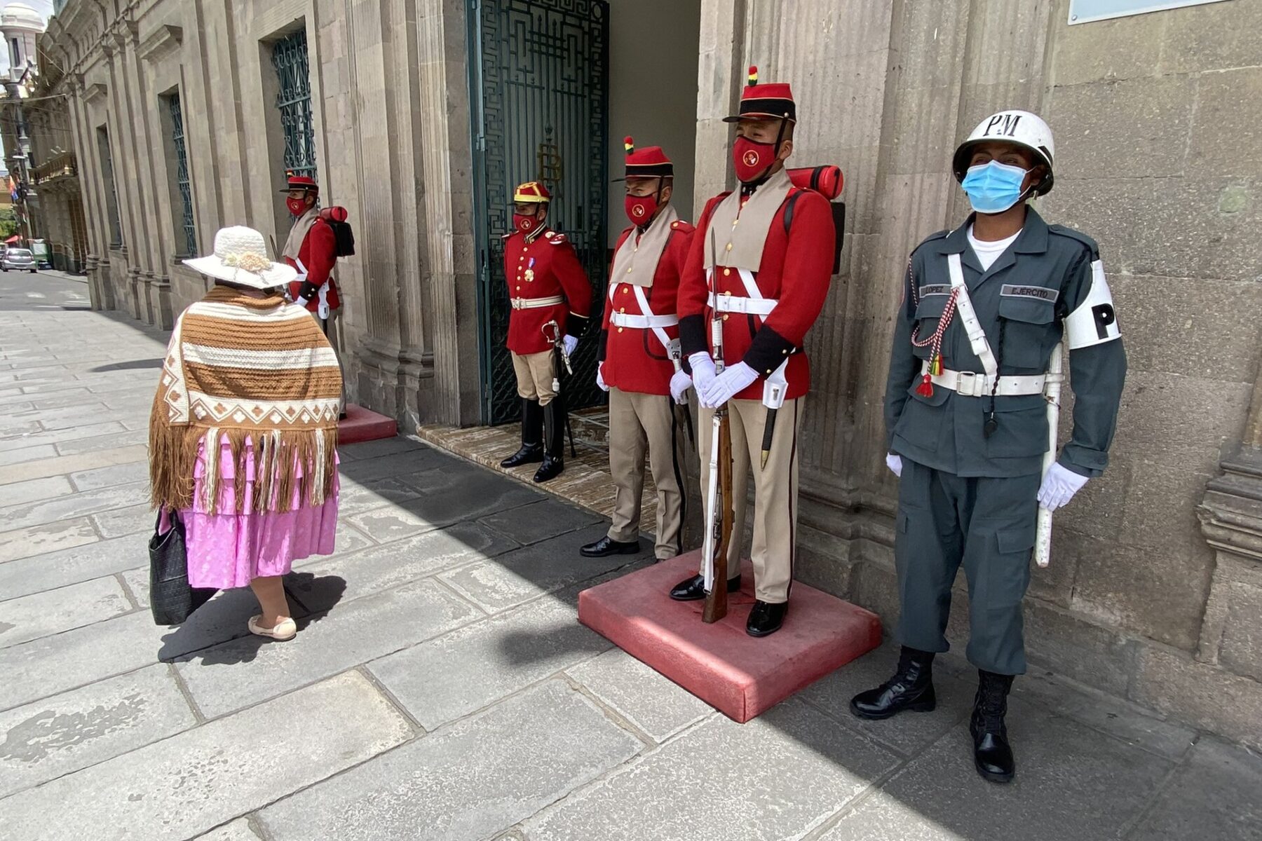 Honour guards in red uniforms outside the Palacio de Gobierno in La Paz, Bolivia