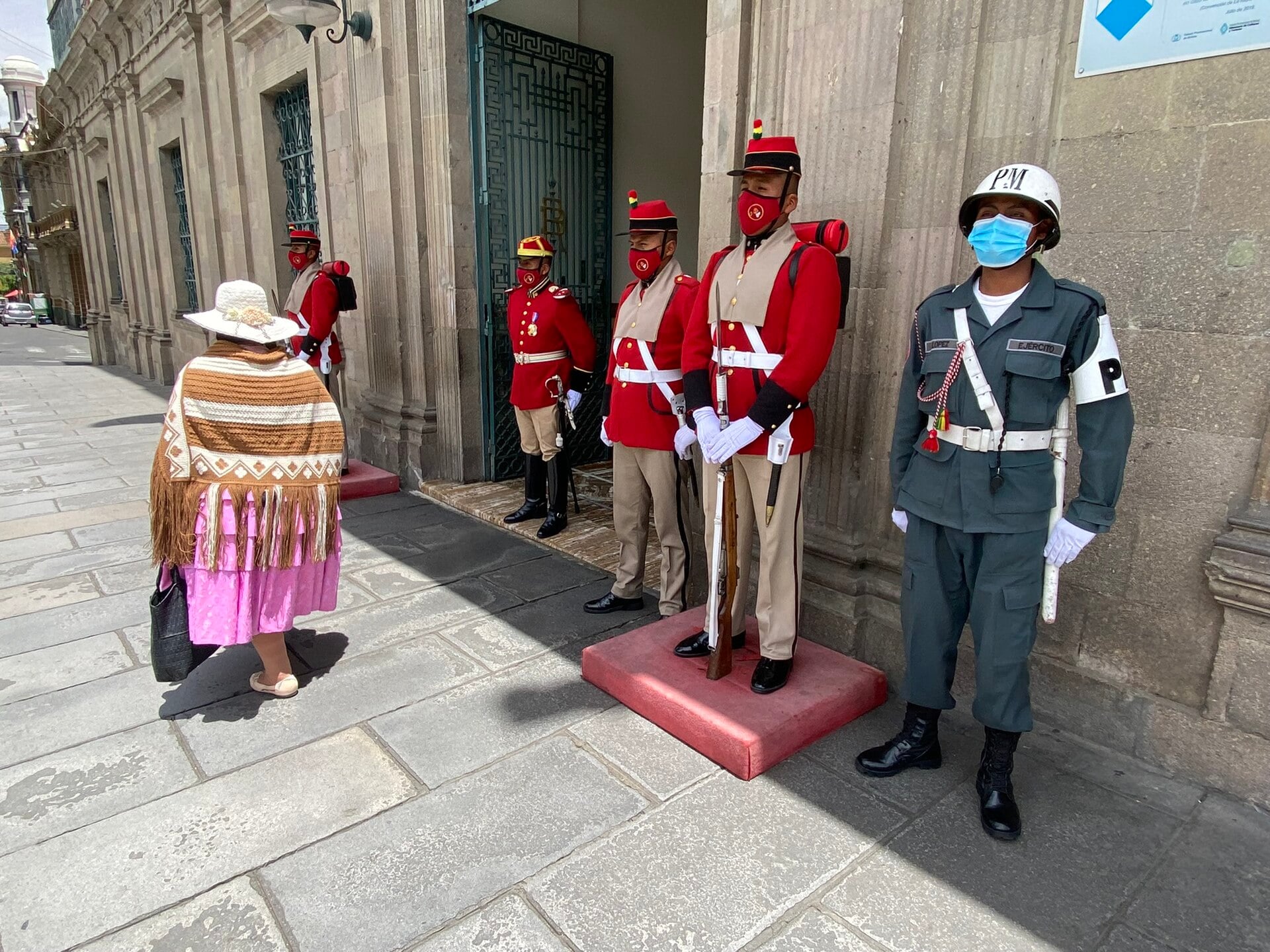 Honour guards in red uniforms outside the Palacio de Gobierno in La Paz, Bolivia