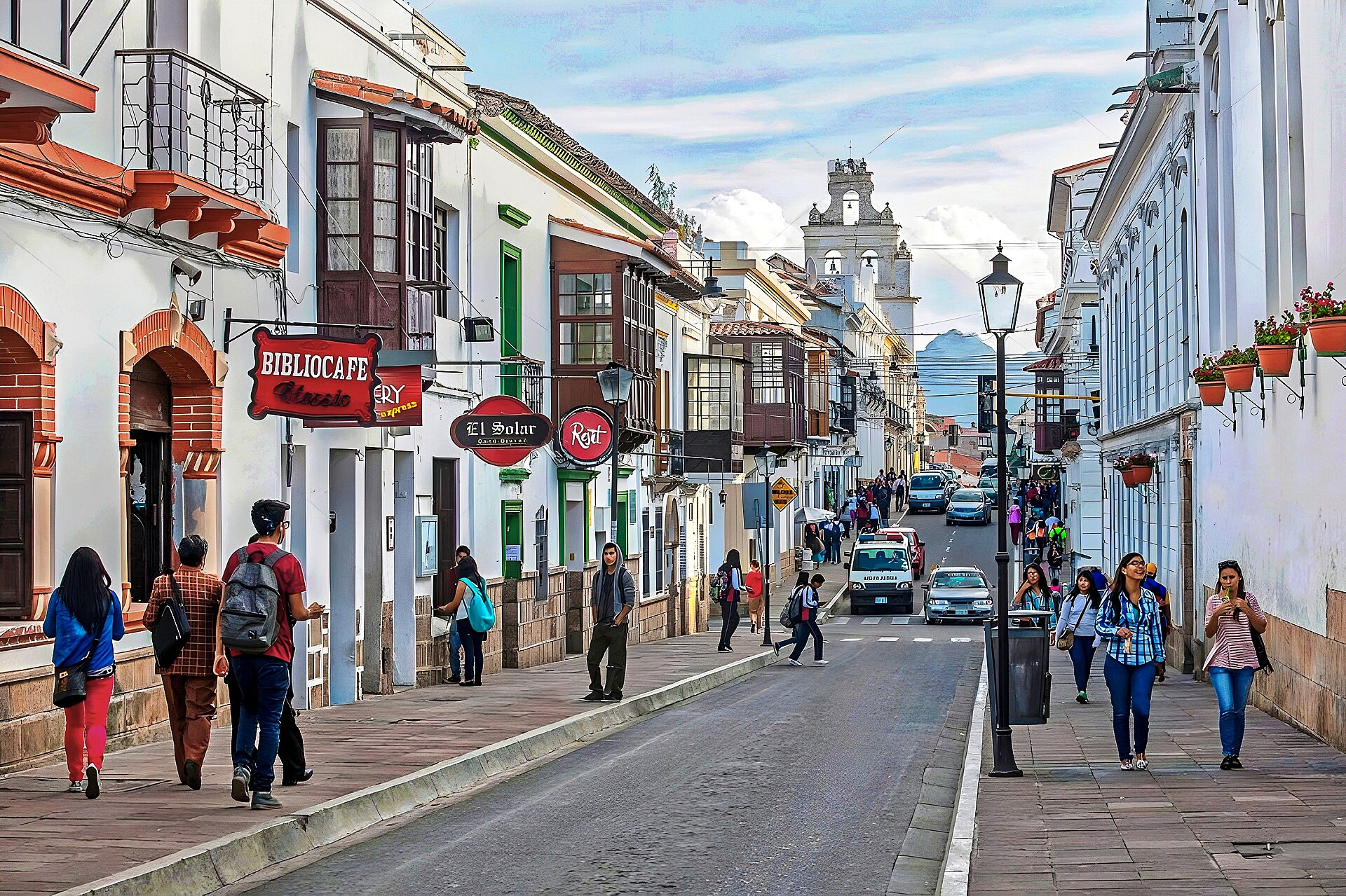 Cars and pedestrians on a colonial street in central Sucre, Bolivia