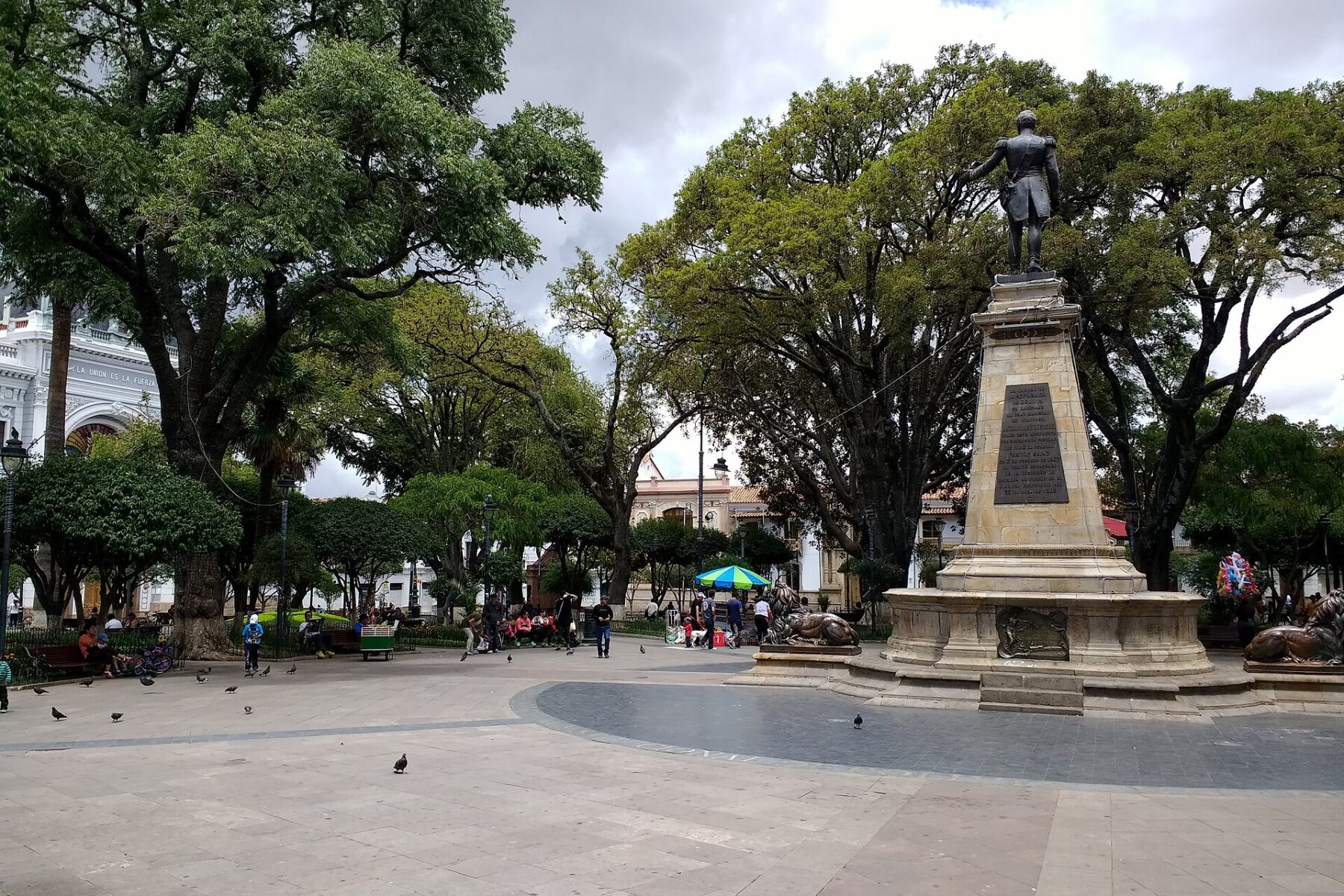 Statue and shaded Plaza 25 de Mayo in Sucre, Bolivia, the constitutional capital