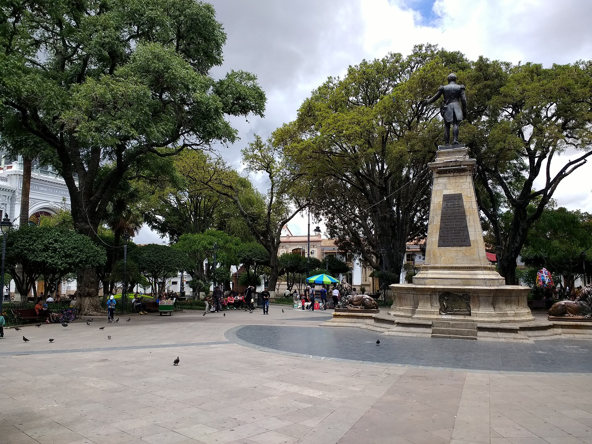 Statue and shaded Plaza 25 de Mayo in Sucre, Bolivia, the constitutional capital