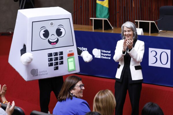 The electoral court ballot-box mascot at an event marking 30 years of Brazil's electronic voting machine, May 2026