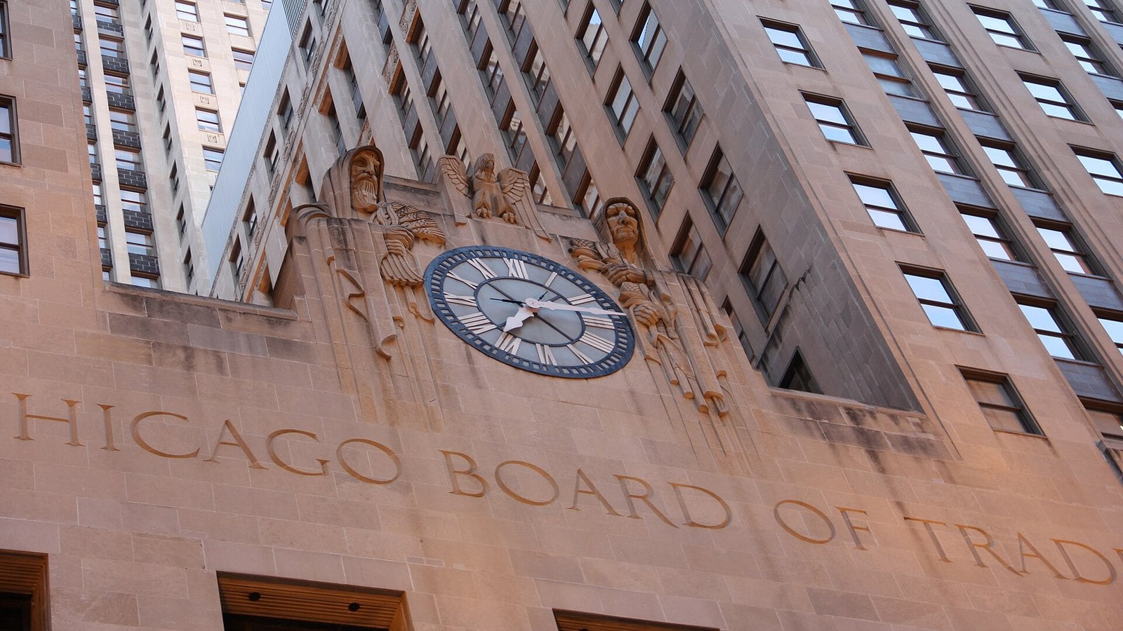 Brazilian real futures: the clock and carved figures above the Chicago Board of Trade inscription on the CBOT Building in Chicago