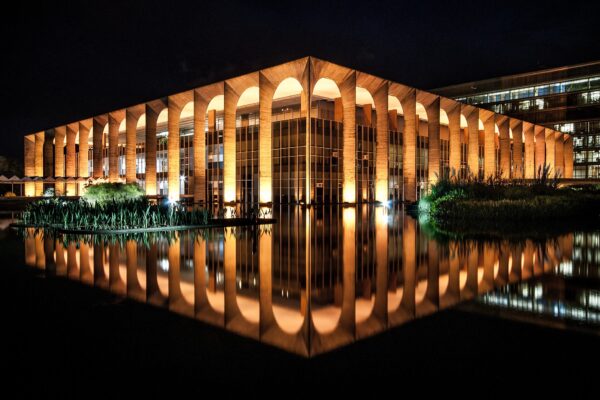 The Itamaraty Palace in Brasília lit at night and reflected in its pool